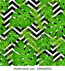 Vector seamless pattern with tropical leaves on abstract white black geometric zigzag background. Cute bright and fun summer floral background. Jungle leaf, exotic palm leaves. Vector illustration.