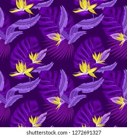 Vector  seamless pattern of tropical purple palm leaves, monstera  leaves  and coral flowers of the bird of paradise (Strelitzia) plumeria on a light blue background. Wallpaper trend design.