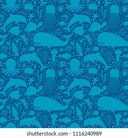 Vector seamless pattern with underwater animals, seaweed and corals silhouettes. Repeated texture with fish, whales and sea animals. Blue sea background.