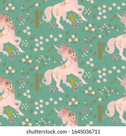 Vector seamless pattern with a unicorn, flowers and succulents. Green background.