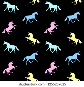 Vector seamless pattern of unicorn silhouette of different pastel colors isolated on black