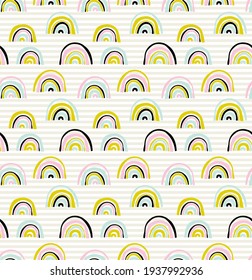 Vector seamless pattern with unusual rainbows drawn by children's hands. Trendy and fashionable print for boys and girls. Illustration for envelopes, textiles, notebooks, and holidays.