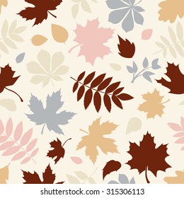 Vector seamless pattern with various colorful autumn leaves on a white background.