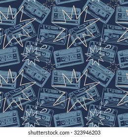 Vector seamless pattern with vintage cassettes, tapes,  old music. 