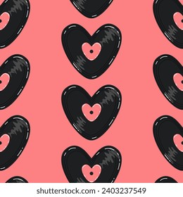 Vector seamless pattern vinyl record heart for lovers on a pink background in a flat cartoon style.
