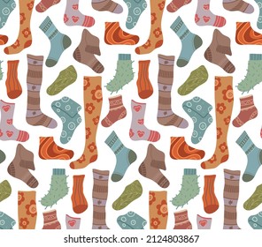 Vector seamless pattern with warm socks on white background. Texture with knitted clothes for legs. Wallpaper with stockings and golfs. Flat hand drawn background.