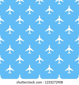 Vector seamless pattern of white airplanes on blue background. 