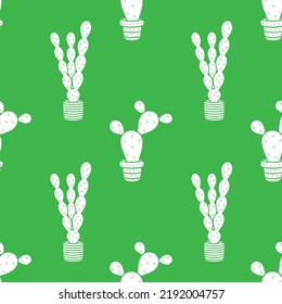 Vector seamless pattern with white cacti on a green background