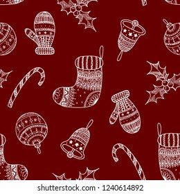 Vector seamless pattern of white Christmas decorative symbols on red background - candy cane, tree ball, mitten, sock, holly, christmas bell. Christmas background