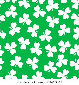 Vector seamless pattern. White clover on a green background. National holiday St.Patrick 's Day.