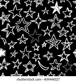 Vector seamless pattern with white freehand drawn cartoon stars on black background