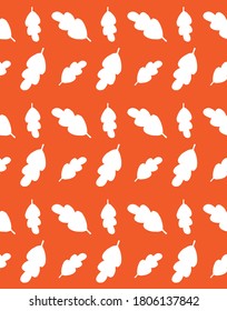 Vector seamless pattern of white hand drawn doodle oak leaf silhouette isolated on orange background