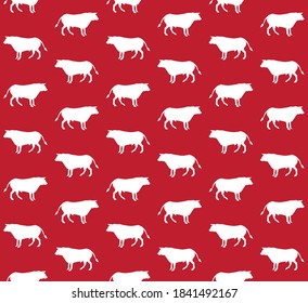 Vector seamless pattern of white hand drawn standing bull silhouette isolated on red background