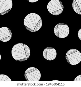 A Vector seamless pattern of white hand-drawn circles polka dot isolated on a black background