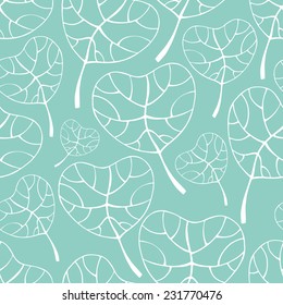 Vector seamless pattern with  white silhouette of tropical leaves on blue background. Seamless decorative template texture with leaves. Endless leaf background. 