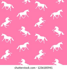 Vector seamless pattern of white unicorn silhouette isolated on pink background 