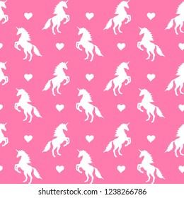 Vector seamless pattern of white unicorn silhouette with heart isolated on pink background 