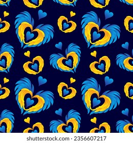 Vector seamless pattern with wings and hearts in yellow and blue colors on a dark blue background. Ukrainian flag colors. Scrapbooking paper.