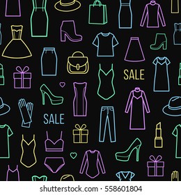 Vector seamless pattern of  women's clothing and accessories. Wrapping paper pattern isolated on black background.