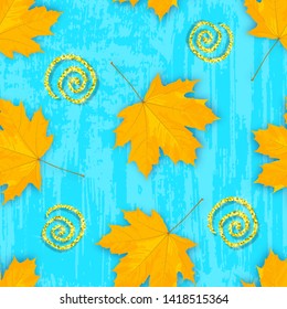 Vector seamless pattern with yellow cartoon maple leaves and glittering elements on the blue grungy background. Colorful autumn texture.