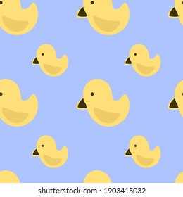 Vector seamless pattern of yellow ducks on a blue background. Drawn by hand in cartoon style, use for scrapbooking, printing on fabric, stationery design