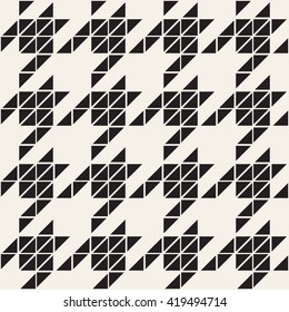 Vector seamless patterns. Classic houndstooth made with small triangles. Modern stylization of traditional print.