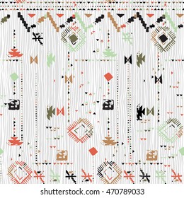 Vector seamless print with stripes and lines, abstract shapes and dots in soft color. Ethnic pattern with native and tribal motif. Woven vintage textile design in aztec style with hand painted chevron