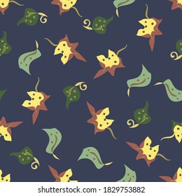 Vector seamless repeat autumnal leafy background in yellow, green and red on a navy backdrop. Cute and quirky design for fall and summer. Stylised leaves make a fun pattern for fabric print.