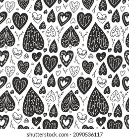 Vector seamless romantic pattern. Black and white ilustartion  of hearts, leaves and branches. Modern design great for Valentine's Day gifts or wrapping paper.
