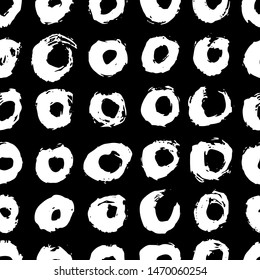 Vector seamless scandinavian ink brush pattern. White circles on black. Minimalistic hand-drawn background, ideal for textiles, wallpaper, fabric, wrapping paper, etc.