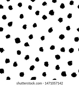 Vector seamless scandinavian ink brush pattern. Black polka dot spots on white. Minimalistic hand-drawn background, ideal for textiles, wallpaper, fabric, wrapping paper, etc.