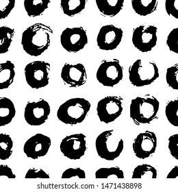 Vector seamless scandinavian ink brush pattern. Black circles on white. Minimalistic hand-drawn background, ideal for textiles, wallpaper, fabric, wrapping paper, etc.
