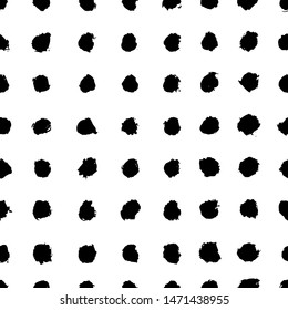 Vector seamless scandinavian ink brush pattern. Black polka dot spots on white. Minimalistic hand-drawn background, ideal for textiles, wallpaper, fabric, wrapping paper, etc.
