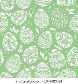 Vector seamless simple pattern with ornamental eggs. Easter holiday green background for printing on fabric, paper for scrapbooking, gift wrap and wallpapers. Cute illustration