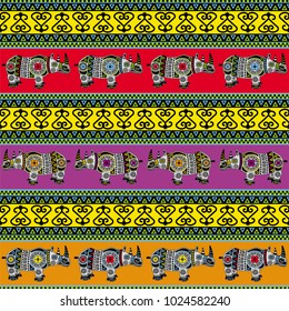 Vector seamless texture with colorful ornaments in an African style and decorated rhinos