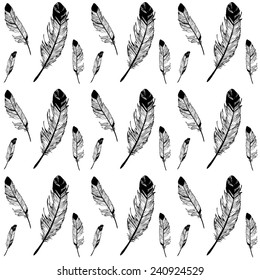 Vector seamless texture with graphic drawing feathers in black and white colors isolated on white. Decorative element