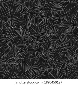 Vector seamless texture with grayscale spider web on a black background. Scarry Halloween monochrome textile or wrapping paper print.