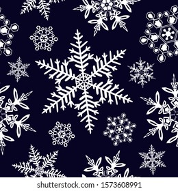 Vector seamless texture. White vector snowflakes on the dark blue background.