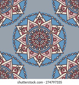Vector seamless traditional ethnic oriental pattern. Colorful folkloric textile design with stylized sun symbols- round mandala