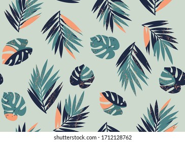 Vector seamless tropical pattern with monstera and palm leaves on a light green background. - Shutterstock ID 1712128762