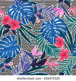 Vector seamless tropical pattern with small triangles at background, vivid tropic foliage, monstera leaf, palm leaves, bird of paradise flower, hibiscus in bloom. modern bright summer print design