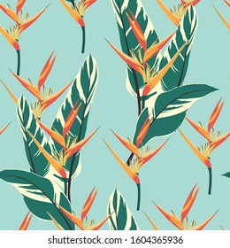 Vector seamless tropical pattern, vivid tropic foliage, with palm leaves, bird of paradise flower, heliconia in bloom. Blue background.