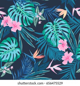 Vector seamless tropical pattern, vivid tropic foliage, with monstera leaf, palm leaves, bird of paradise flower, hibiscus in bloom. modern bright summer print design
