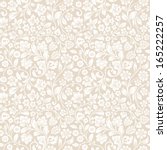 Vector seamless vintage floral pattern. Stylized silhouettes of flowers and berries on a beige background. White flowers. 
