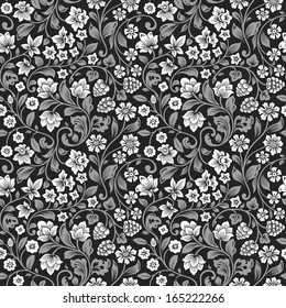 Vector seamless vintage floral pattern. Stylized silhouettes of flowers and berries on a black background. White flowers with gray leaves.