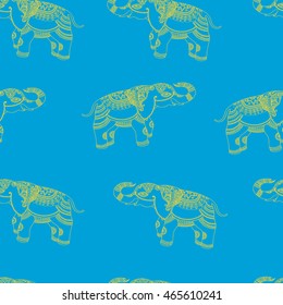 Vector seamless vintage pattern with ornamental indian Elephant. Hand drawn ethnic illustration with tribal elements for print, textile, wrapping and other seamless fashion boho design.Yellow on blue.