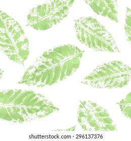 Vector seamless watercolor pattern with green imprints of leaves 
