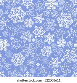 Vector seamless white snowflakes on blue background.