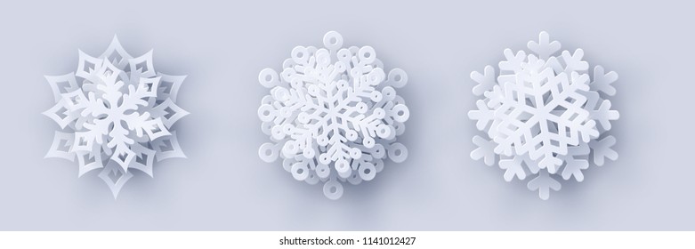 Conjunto de vectores de 3 papel blanco de Navidad cortado copos de nieve 3d con sombra sobre fondo blanco. Elementos de diseño de Año Nuevo y Navidad