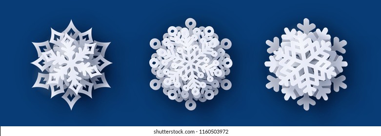 Vector set of 3 white Christmas paper cut 3d snowflakes with shadow on dark blue background. New year and Christmas design elements